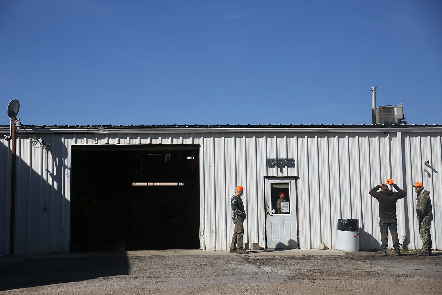 Hunters wait outside Big Horn Meat Cutting